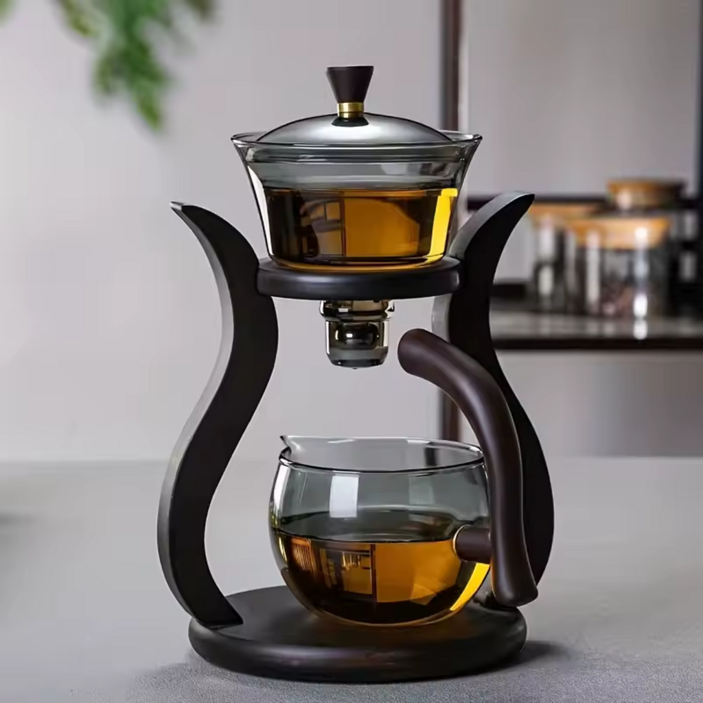 Tea Harmony glass brewing system with amber tea in both pots on minimalist background